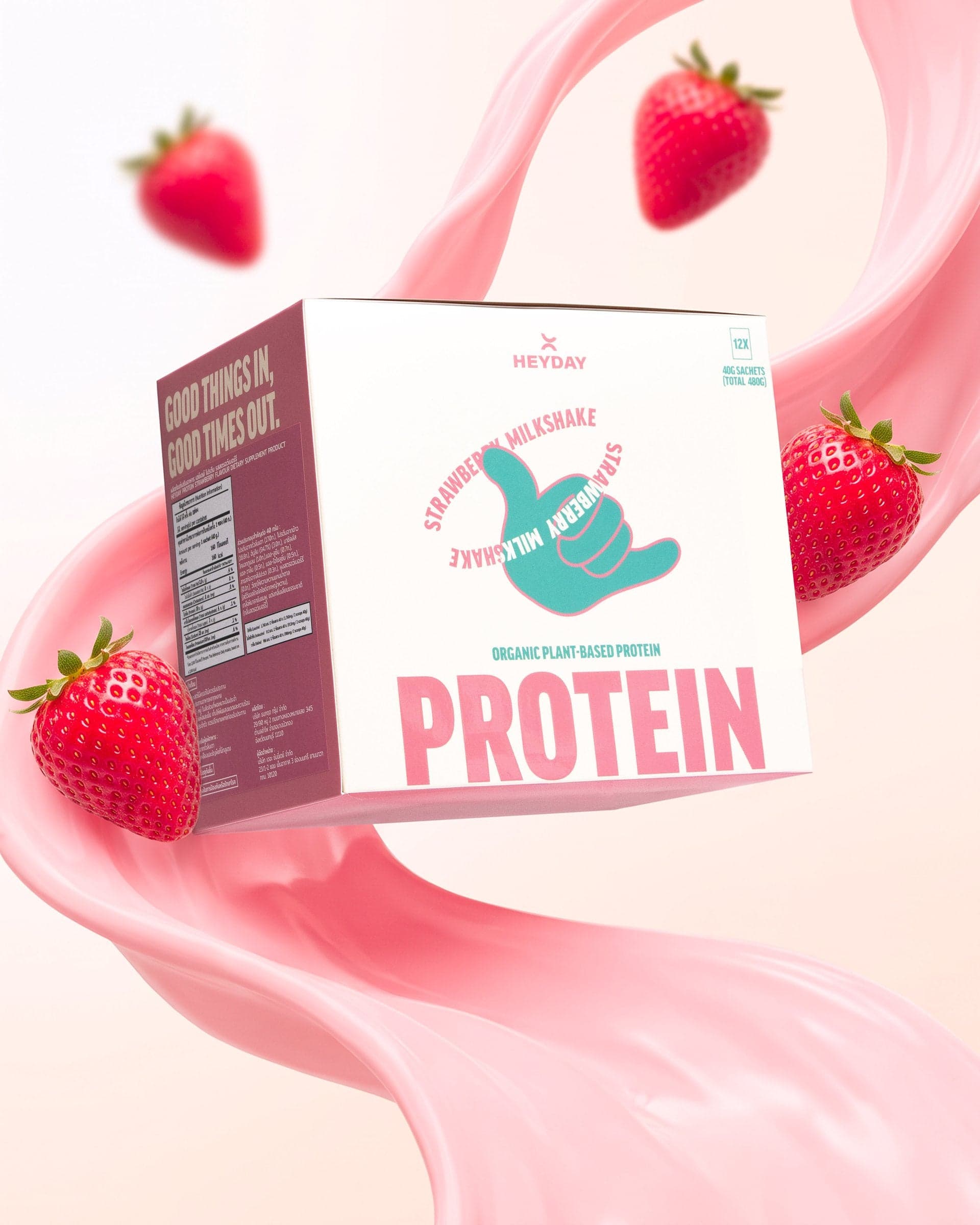 Heyday Strawberry Milkshake protein box in a swirl of strawberry milk